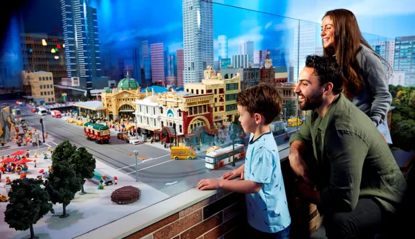 parents and kids looking at miniland